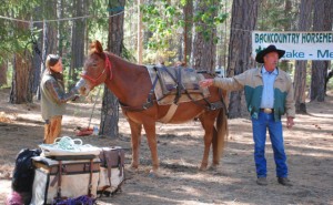 Image: Debbie Watson and Paul Villanueva of the Lake-Mendo Unit of the Back Country Horsemen demonstrate how to pack a mule for the backcountry.